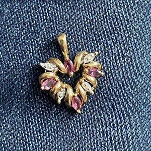 10 karat yellow gold pendant with rubies and diamonds